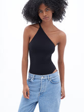 Load image into Gallery viewer, Filippa K Asymmetric Swimsuit - Black - front model styled with blue jeans
