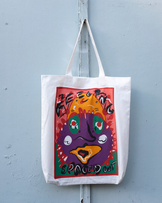 Henrik Vibskov Spaced Out Tote - front. This tote features a woozy funky abstracted face graphic!