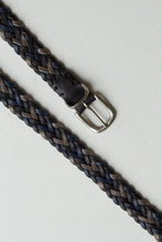 Load image into Gallery viewer, The braid belt in finished with a silver buckle - simply synch the belt at any length by slipping the closure bar through the woven leather strips. 

