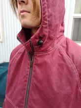 Load image into Gallery viewer, Old Fashioned Standards Waxed Bomber Jacket - Burgandy - model wearing jacket hood and drawstring hood synch, front zip
