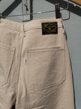 Load image into Gallery viewer, Old Fashioned Standards - Workhorse Trouser - Oatmeal Pre Wash - back closeup of brand logo and pockets
