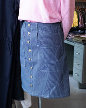 Load image into Gallery viewer, old fashion standards button skirt in light denim, on our store mannequin, styled with Minimum&#39;s Aska sweater in pink!
