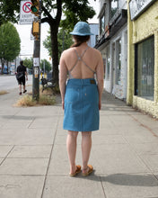 Load image into Gallery viewer, Old fashion standards button skirt and 6 panel cap in light denim styled with filippa k halter printed swimsuit in beige stripe paired with no.6 contour clog in tobacco - back
