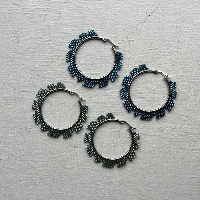 Ripsaw Hoops Earrings - Medium. Shown in blue and light teal silver.