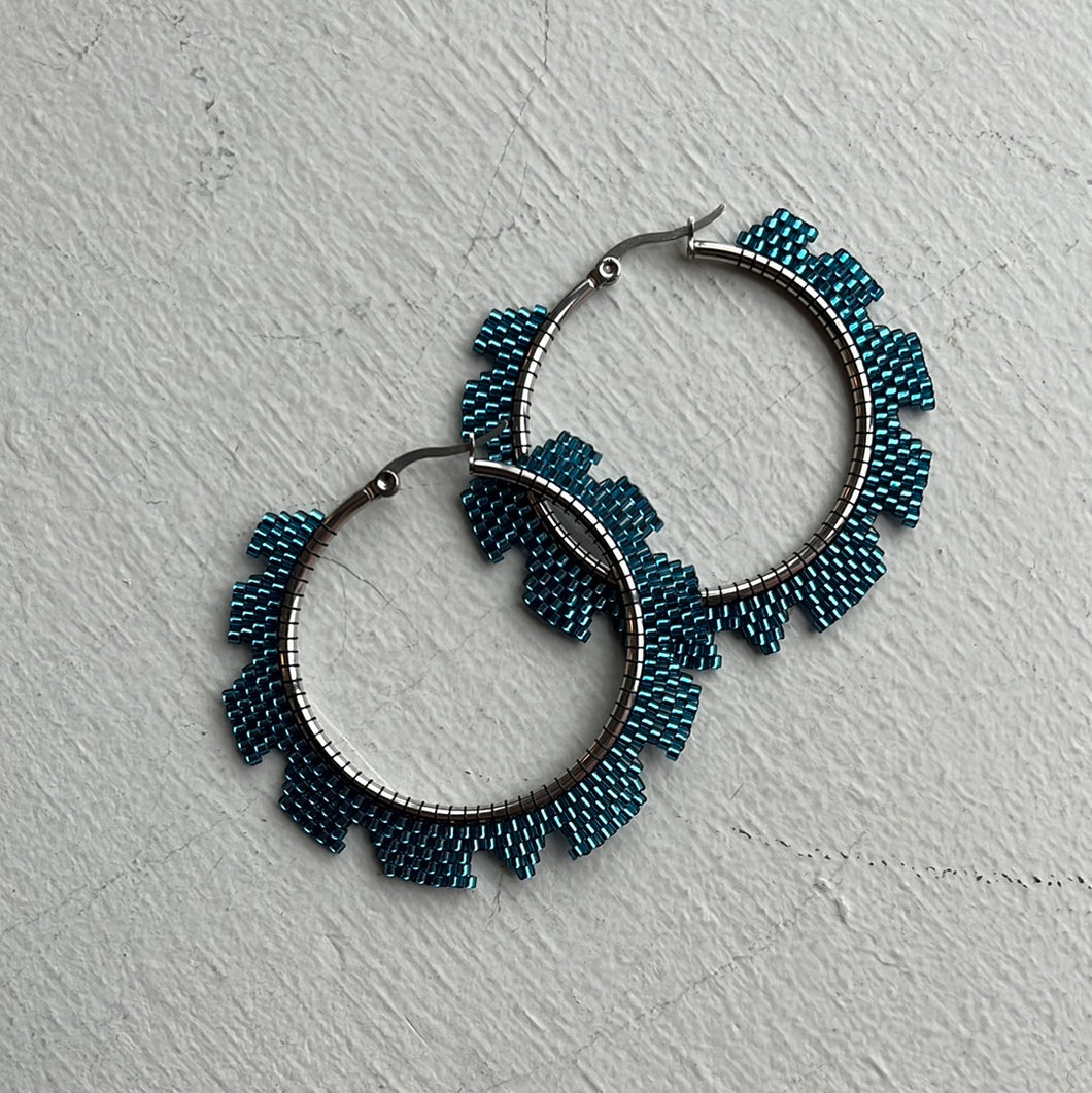 Ripsaw Hoops Earrings - Medium. In blue.