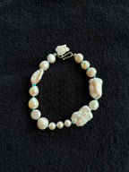 Monica Berdin - Freshwater pearl bracelet with sterling silver clasp on a black background