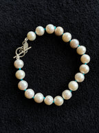 Monica Berdin - Freshwater pearl bracelet with sterling silver clasp on a black background