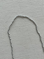 Monica Berdin - Mini pearls necklace on black silk necklace closeup