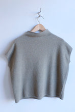 Load image into Gallery viewer, this photograph depicts the front of the sweater. it is a boxy fit with hung sleeves.
