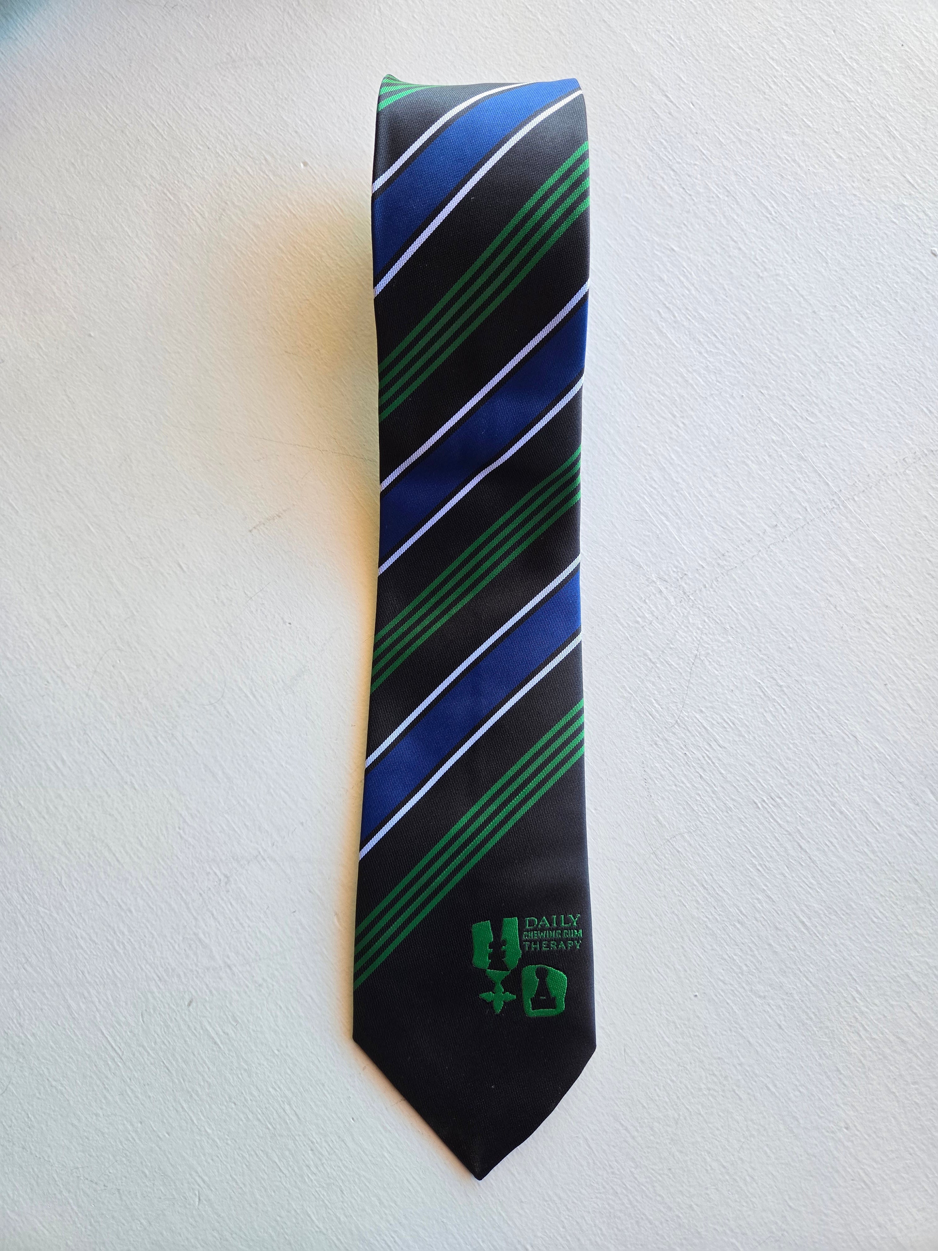 Henrik Vibskov - Chewing Tie in Chess Navy, with collection name embroidered.