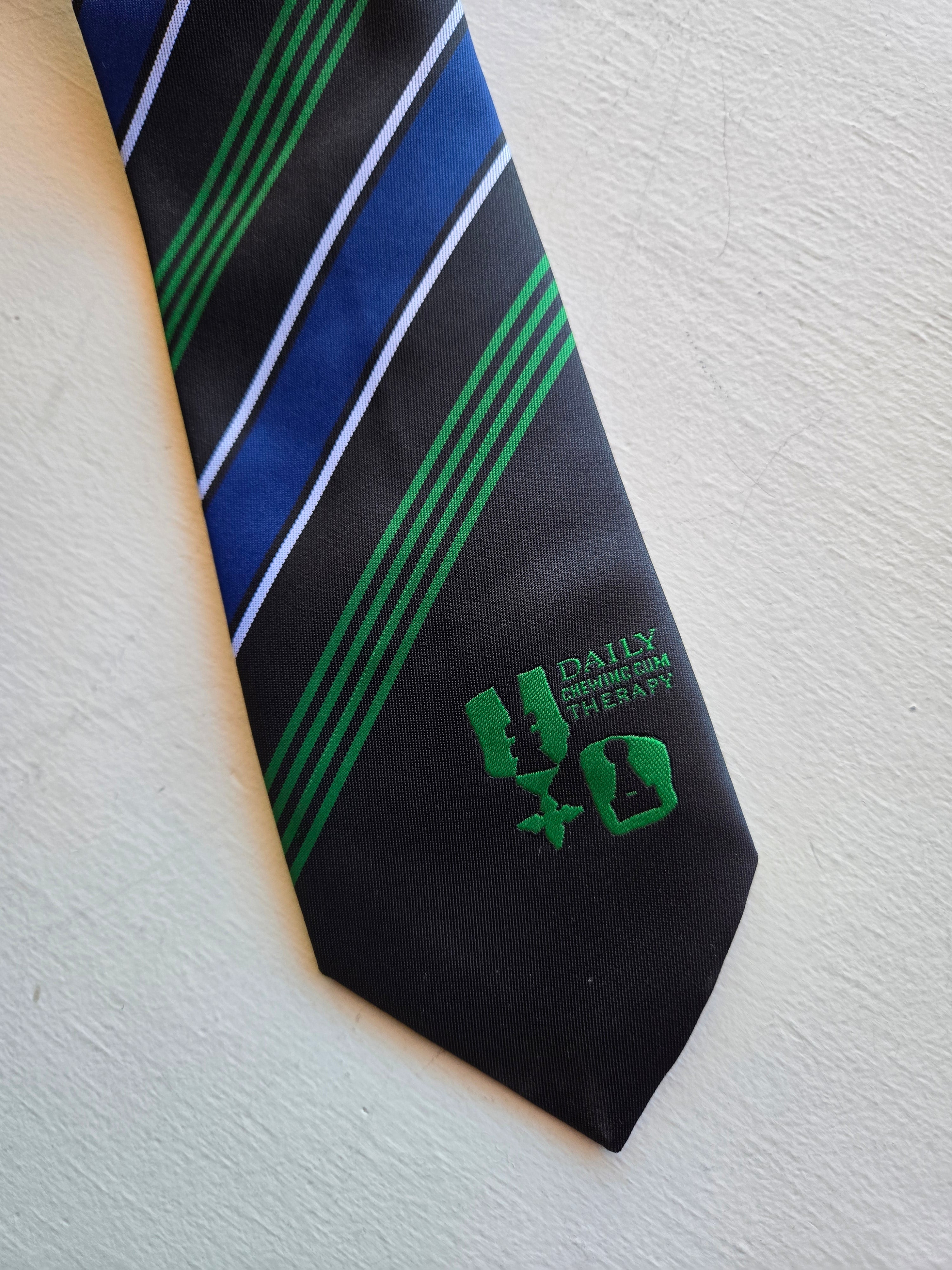 Henrik Vibskov - Chewing Tie in Chess Navy, with collection name embroidered.