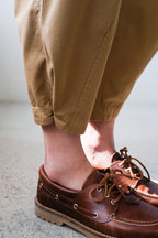 Homecore - Kelani Ripstop Pants - Desert Beige - hem detail, buttoned up
