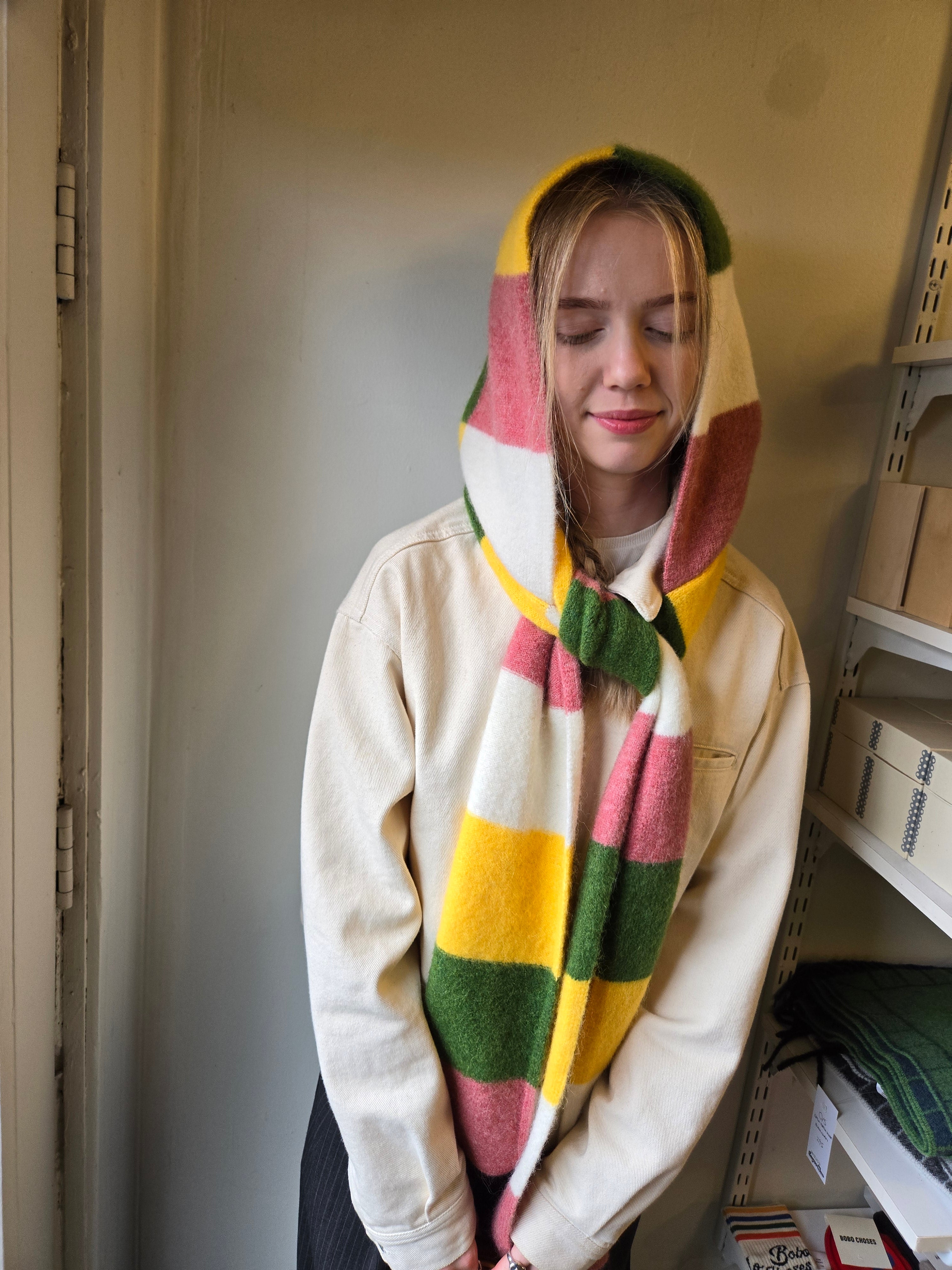 Homecore Baby Hood & Scarf - Multi Green, worn as hood on model front