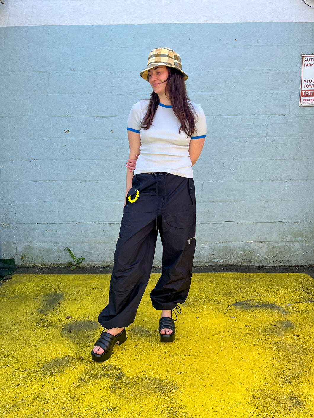Samsoe  samsoe - Chi Trousers - Caviar - front. this pant has cinch roping at the bottom hem, and fours pockets, two at the side of the knees, with zipper, and two at the waist with flaps.