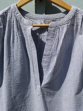 Load image into Gallery viewer, Wemoto Eileen Blouse - Navy Blue - front closeup of split neck construction detail, and seersucker fabric
