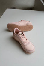 Load image into Gallery viewer, Woden Nora III sneaker in Rose Bloom, a classic baby pink with a soft supple hue. Designed with a rounded toe and beige faux snake skin details on the top of the heel. 

