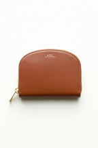 A.P.C Demi-Lune Coin wallet in Hazelnut: this wallet is a warm dark brown in a smooth matte finish