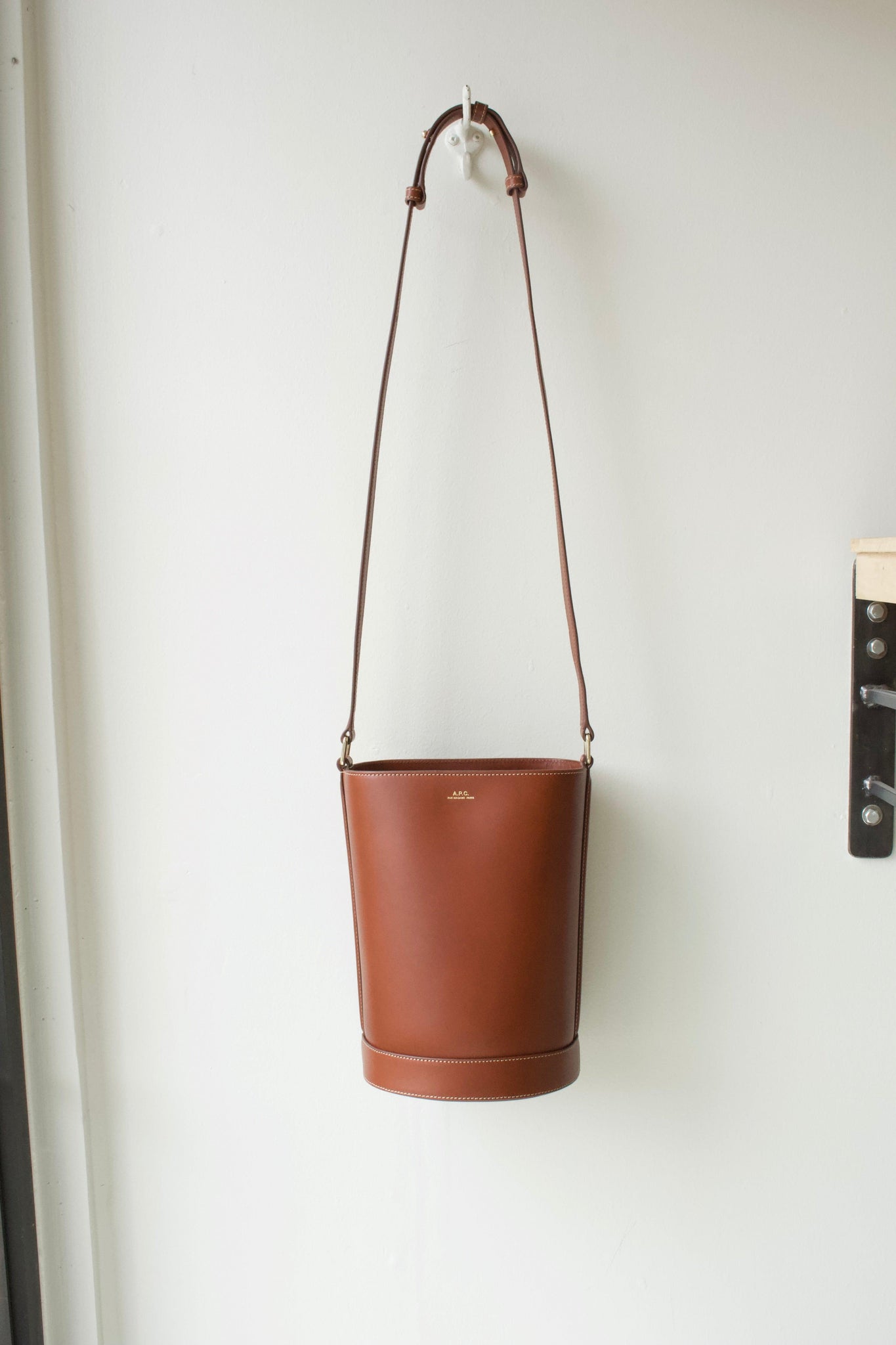 A.P.C. Sac Ambre Logo Bucket Bag in Black