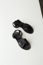 Load image into Gallery viewer, Matte black &#39;salt-water&#39; style ladies sandals. The Chloe sandals have criss-crossed foot supports and an open toe. 
