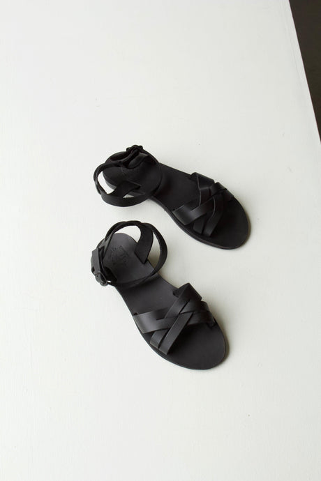 Matte black 'salt-water' style ladies sandals. The Chloe sandals have criss-crossed foot supports and an open toe. 