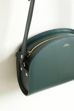 Load image into Gallery viewer, A.P.C Demi-Lune Bag in Vert Sapin - Eugene Choo - Women&#39;s Accessories: a close up pf the side profile and gold toned hardware 
