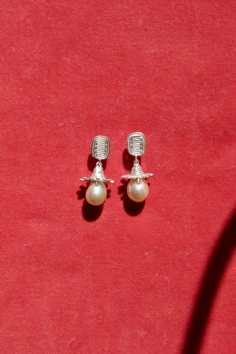 Hatty Earrings by Erica Leal. These sterling silver studs have chunky silver droplets finished with freshwater pearl stones. 