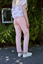 Load image into Gallery viewer, A rear shot of the Workhorse pants in pink show off the large rear square patch pockets. 
