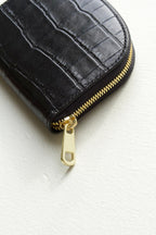 A.P.C Demi-Lune Coin wallet: detail shot of the close up gold tonal zipper