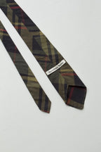 A close up of the underside of the green plaid tie - this tie is unlined 