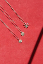 Load image into Gallery viewer, A picture of the posey, daisy and spiral pendant necklaces from vancouver designer Erica Leal. 
