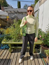 Load image into Gallery viewer, Filippa K - Natalia Sweater in Pale Green - front standing with Samsoe Samsoe Amira Shopper in Vibrant Green
