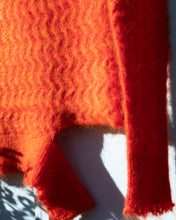 Load image into Gallery viewer, Ka Wa Key Deconstructed Mohair Cable Sweater - flat detail. This photograph depicts the sweater&#39;s zig zag cable knit detail, bottom left cutout above the ribbing, and frayed ends.
