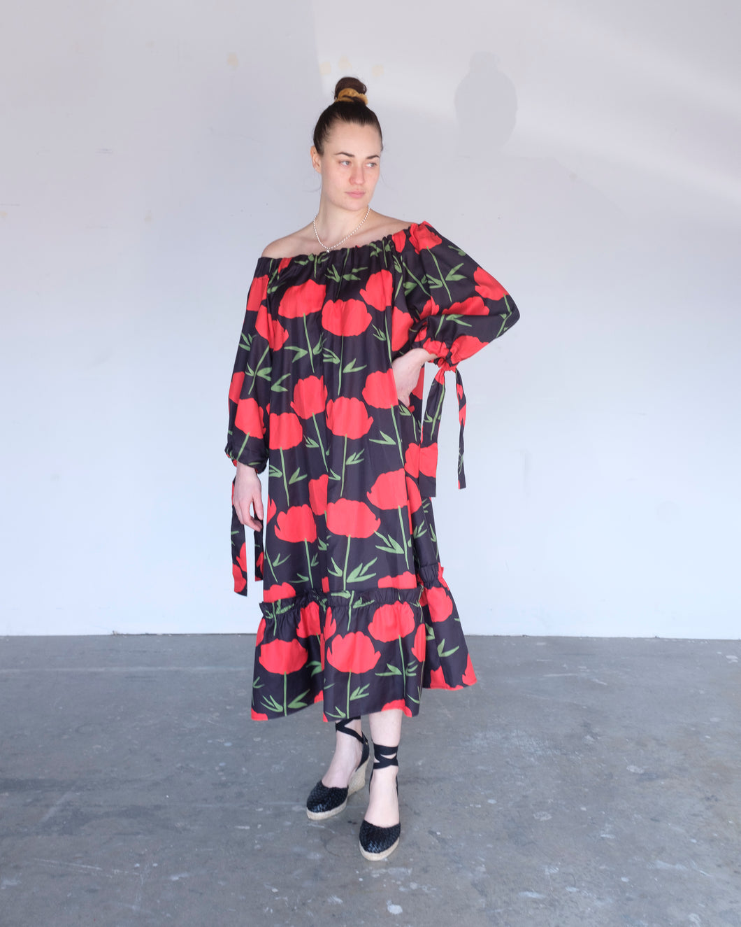 Ka Wa Key - Kullero Maxi Dress - Kullero - front. In this image, the Kullero dress is worn off shoulder and cinched in the wrist (this is adjustable by re-tying the strings in the back and sleeves)
