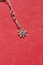 Load image into Gallery viewer, A close up of the flower charm on the Melanie necklace from erica leal. 

