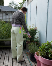 Load image into Gallery viewer, In this image, Jamie is watering the rosemary on our store patio, wearing color-matched Filippa K Viana Jean and Natalia Sweater with No.6&#39;s Lane Cardigan (which breaks apart the pale green with its lovely lilac color and bold black and white diamond pattern). We accessorized this outfit with the neon green Horsehair Tassel Keychain with neon pink acrylic tag from FREDERICKS &amp; MAE.

