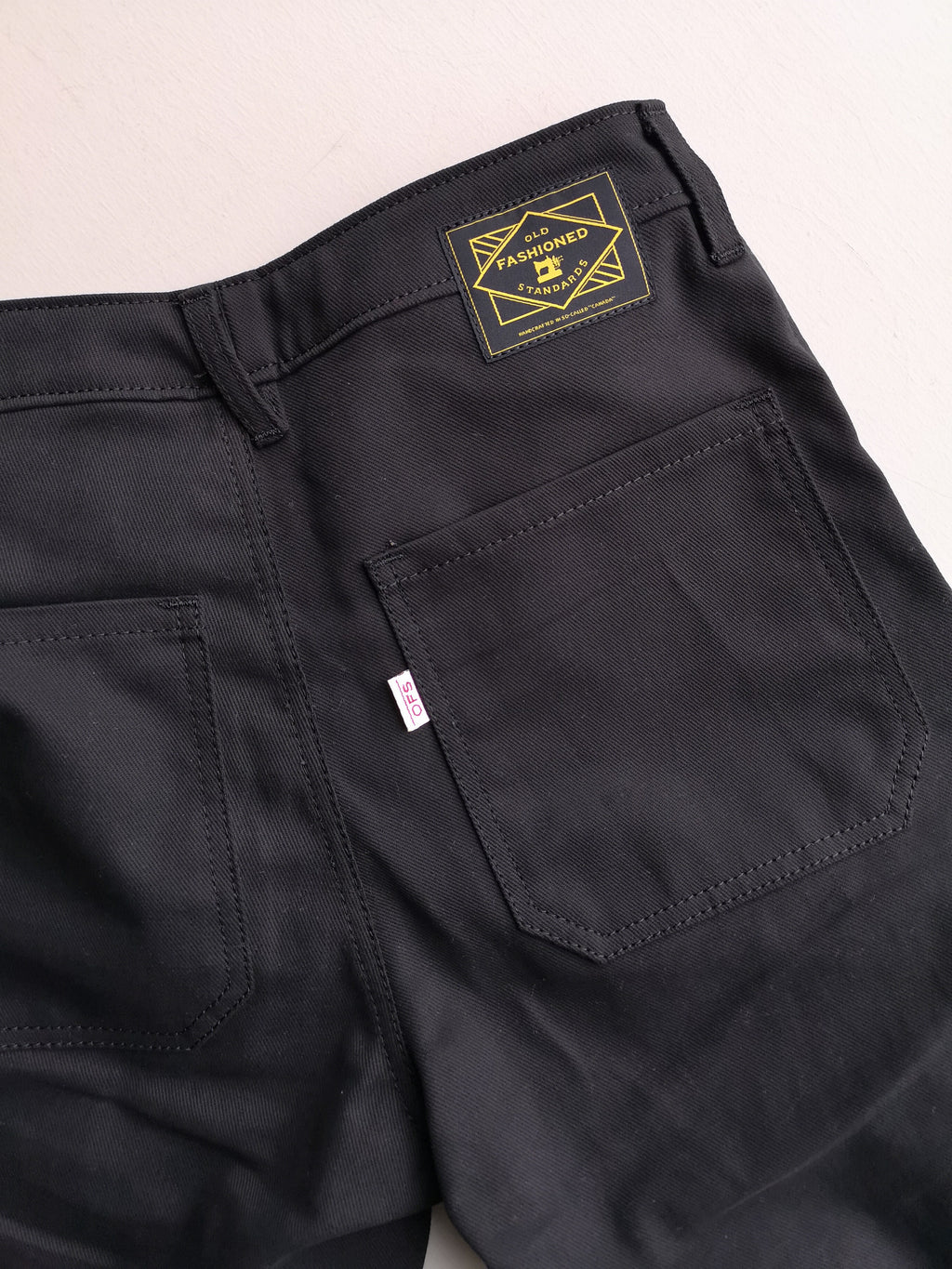 Old Fashioned Standards - Workhorse Trouser - Black - back closeup of pocket, brand label