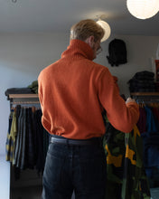 Load image into Gallery viewer, Universal Works Roll Neck Wool Sweater - Orange - back, tucked
