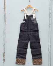 Load image into Gallery viewer, On the back, W&#39;menswear&#39;s Holiday Dungaree provides two more hip pockets with top flaps, and a side long pocket for your tools on the right leg.
